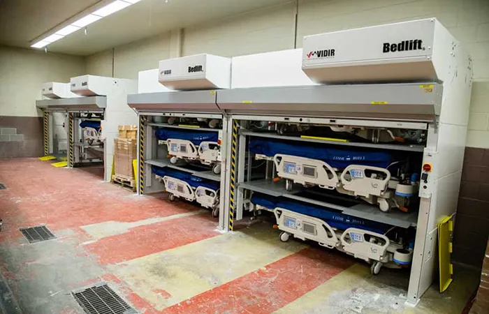 Hospital storage room with Vidir bedlifts