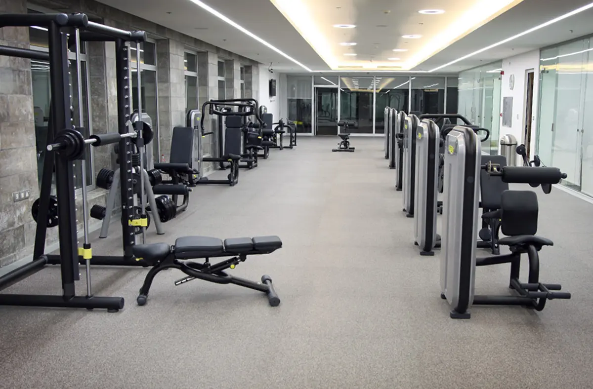 Dinoflex recycled rubber flooring under cable machines and benches